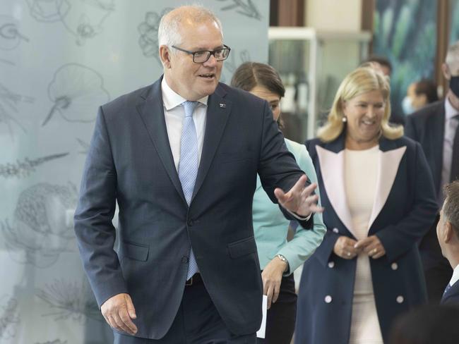 SYDNEY, AUSTRALIA - NewsWire Photos JANUARY 31, 2021: Australian Prime Minister Scott Morrison waves to NSW Minister for Transport and Roads Andrew Constance on arrival for the launch of i4give Day at  The Calyx, Royal Botanic Gardens in Sydney. Picture: POOL via NCA NewsWire / Jenny Evans