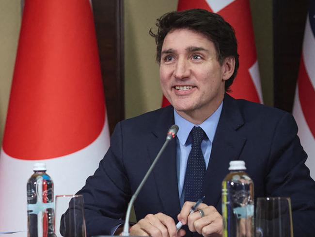 In this handout photograph taken and released by the Ukrainian Presidential Press Service on February 24, 2025, Ukraine's President Volodymyr Zelensky (L) and Canada's Prime Minister Justin Trudeau (R) attend a meeting with European leaders via video link in Kyiv, to mark the third anniversary of the Russian invasion of Ukraine. (Photo by Handout / UKRAINIAN PRESIDENTIAL PRESS SERVICE / AFP) / RESTRICTED TO EDITORIAL USE - MANDATORY CREDIT "AFP PHOTO / HANDOUT / UKRAINIAN PRESIDENTIAL PRESS SERVICE" - NO MARKETING NO ADVERTISING CAMPAIGNS - DISTRIBUTED AS A SERVICE TO CLIENTS