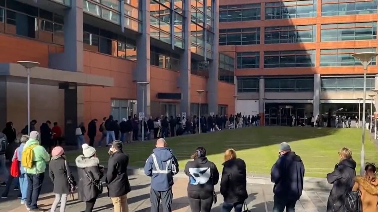 The queues snaked all around the building. Picture: 9News