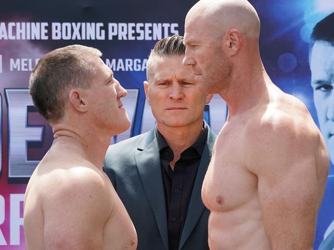 Paul Gallen (left) and Barry Hall face off as promoter Danny Green looks on. Picture: AAP