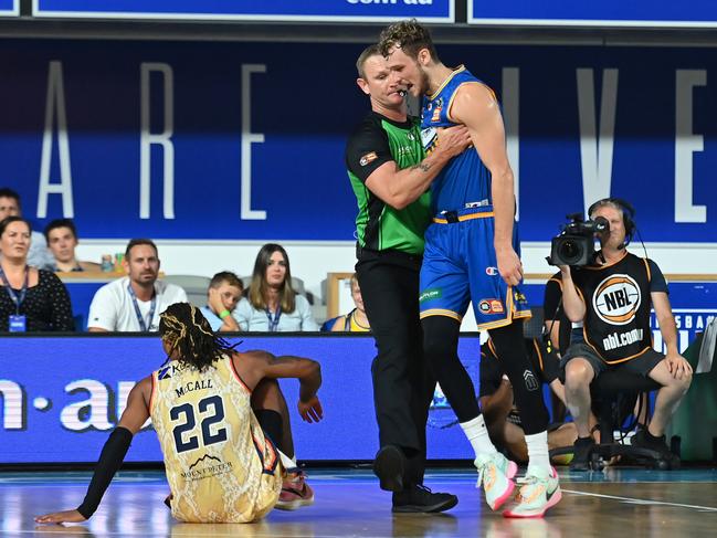 Tanner Krebs had to be held back after clashing with Cairns’ Tahjere McCall. Picture: Albert Perez/Getty Images