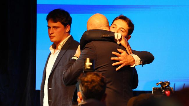 Peter Dutton is hugged by one of his after conceding the election and his own seat. Picture: NewsWire/Tertius Pickard