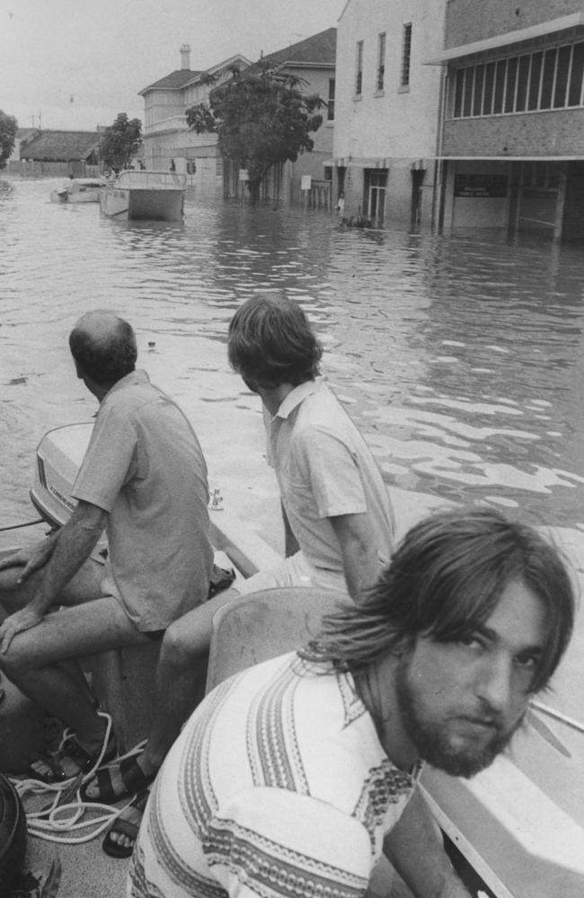 A rescue boat motors along Margaret Street in Brisbane’s CBD during the 1974 floods. Picture: News Corp Australia