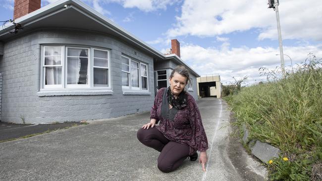 Janet Hinson at the side of her property, which she has discovered has a historical encroachment, meaning she’s unable to develop. Picture: EDDIE SAFARIK