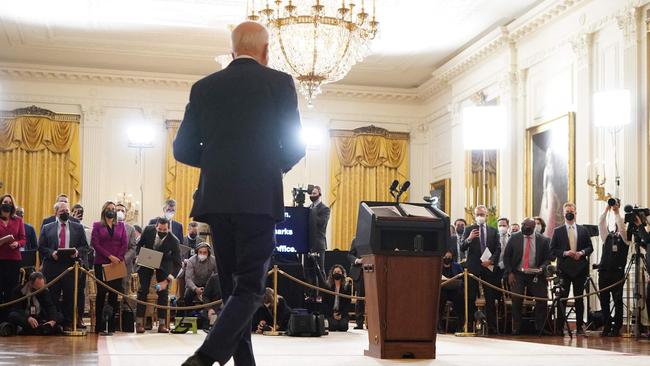 Joe Biden arrives for his press conference on the eve of his first year in office, from the East Room of the White House. Picture: AFP