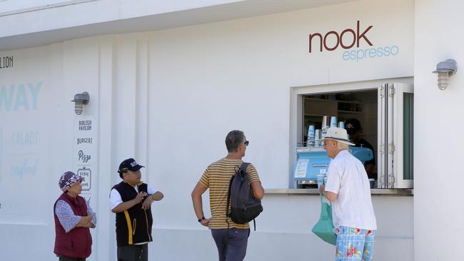 Marcus Wilkins and Olivia Ayres serve up coffee at Nook in Burleigh. Picture: Tertius Pickard