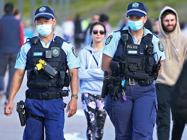 NSW Police are wear masks at Sydney's Maroubra Beach. Picture: NCA NewsWire / Nicholas Eagar