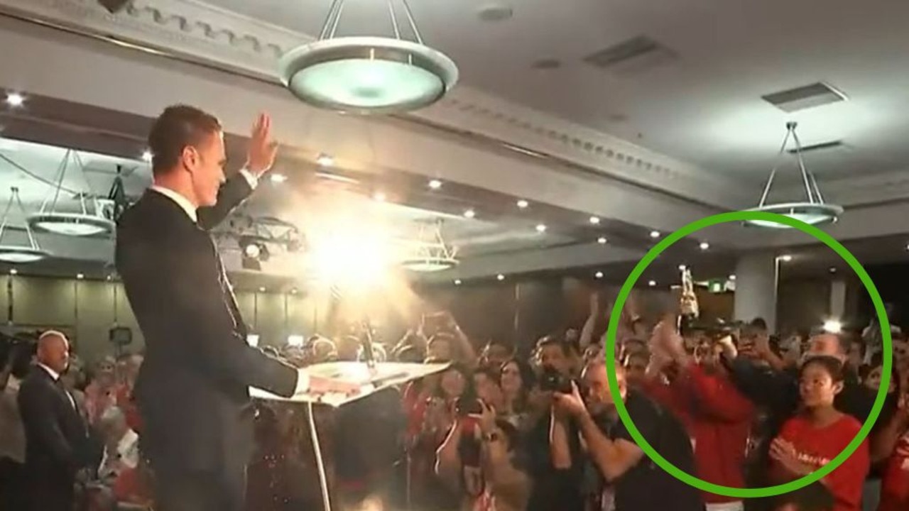 Chris Minns (left) resisted the urge to do a ‘shoey’ just moments after his victory speech in front of a roaring crowd at Labor HQ. Picture: Sky News