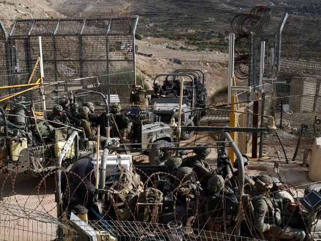 Israeli military forces cross the fence to and from the buffer zone with Syria, near the Druze village of Majdal Shams in the Israel-annexed Golan Heights. Picture: AFP