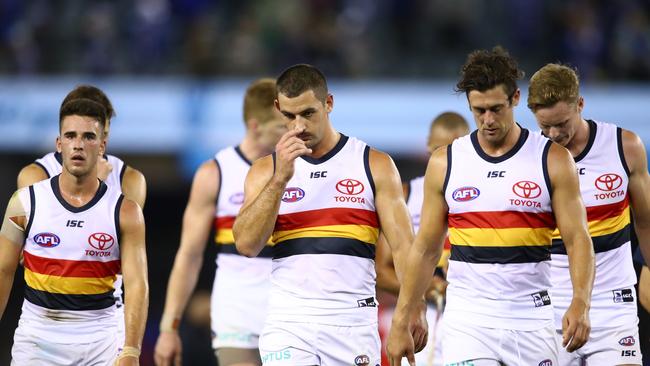 Adelaide’s Taylor Walker leads teammates off the ground following Round 4 loss to North Melbourne at Marvel Stadium. Picture: Scott Barbour/Getty Images