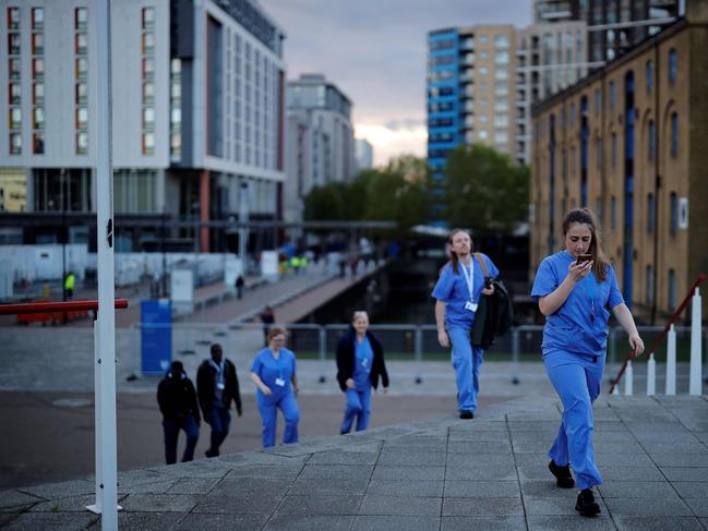 Medical staff walk into the NHS Nightingale field hospital in London. Picture: AFP