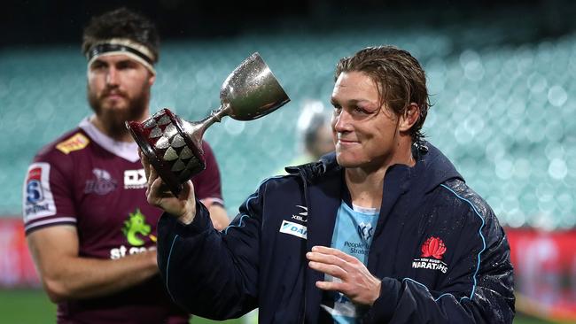 Waratahs interim captain Michael Hooper with the Bob Templeton Cup after defeating the Reds at the Sydney Cricket Ground