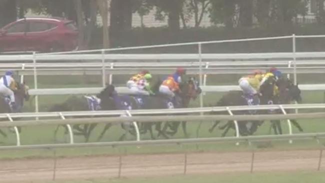 Jockey Rachel Shred hits the Cluden Park surface after taking fall in race.