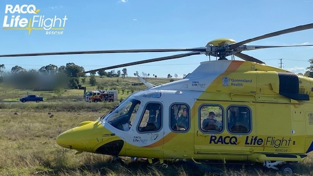 A woman from Harristown has been left with critical injuries following a crash on the Warrego Highway near Plainlands. Picture: RACQ LifeFlight Rescue