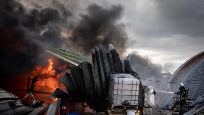 Firefighters try to extinguish a fire after a chemical warehouse was hit by Russian shelling on the eastern frontline near Kalynivka village. Picture: Chris McGrath/Getty Images