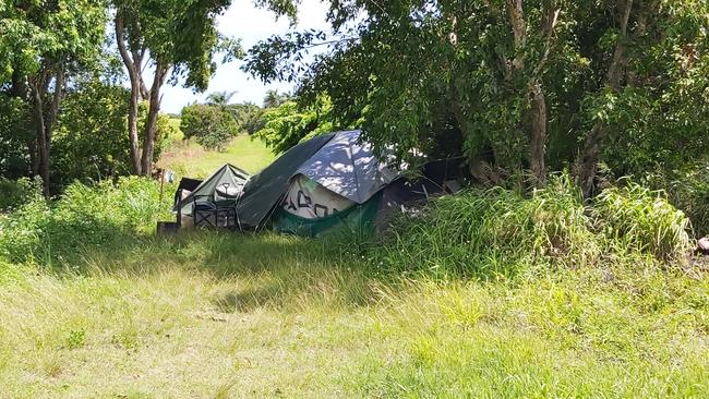 The man, his dog and his partner are squatting on private property near Mackay-Bucasia Rd. Picture: Duncan Evans