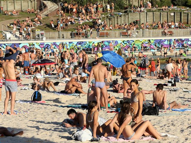 Social distancing will be monitored as people return to the beach for exercise. Picture: AAP/John Fotiadis