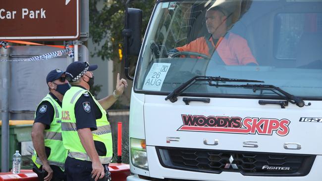 Police and Emergency Services stop members of the public on the border for questioning. Picture Glenn Hampson