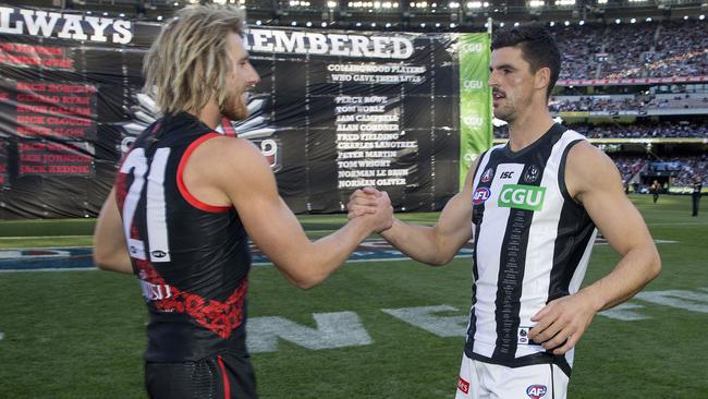 Dyson Heppell and Scott Pendlebury will lead their teams in Friday night’s blockbuster. Picture: Michael Klein