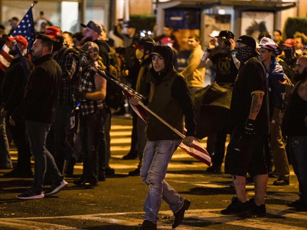 Members of Antifa and Proud Boys clash in the middle of the street following the Million MAGA March to protest the results of the 2020 presidential election. Picture: AFP