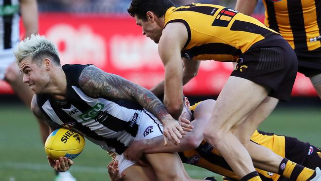 The Hawks put the clamps on Jamie Elliott. Picture: Michael Klein