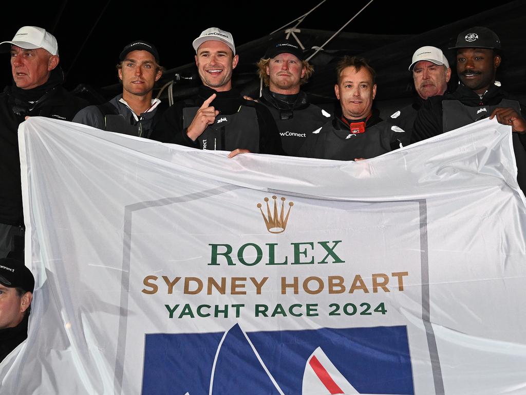 The LawConnect crew pose for a photo after winning line honours in the 2024 Sydney to Hobart. Picture: Getty Images