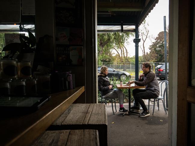 Melburnians enjoy a sit-down coffee in Port Melbourne on Friday. Picture: Getty