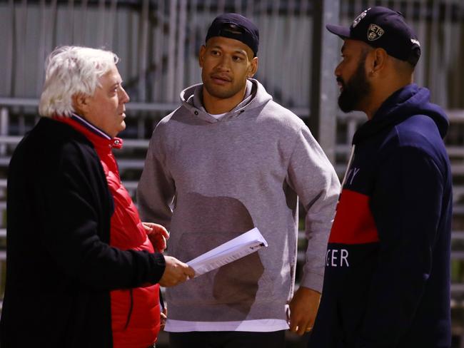 GOLD COAST, AUSTRALIA - MAY 27: Clive Palmer, Israel Folau and Tony Williams talk at Owen Park on May 27, 2021 in Gold Coast, Australia. (Photo by Chris Hyde/Getty Images)