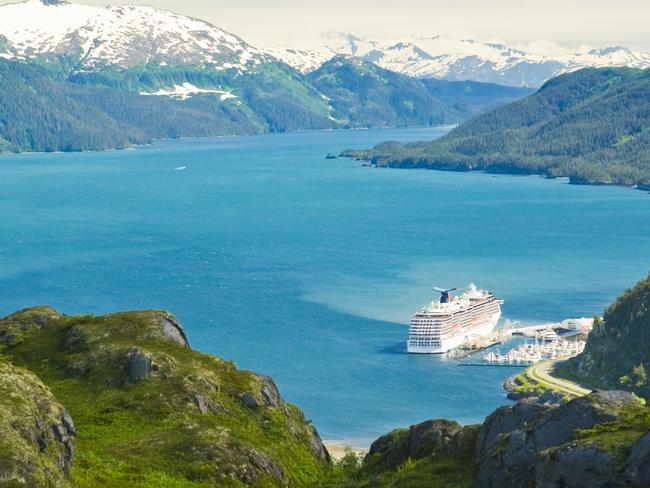 ESCAPE: CRUISE COVER OPTION  ..  View of a Princess cruise ship docked at Whittier with hiker on Portage Pass, Chugach National Forest, Alaska. Picture: Getty