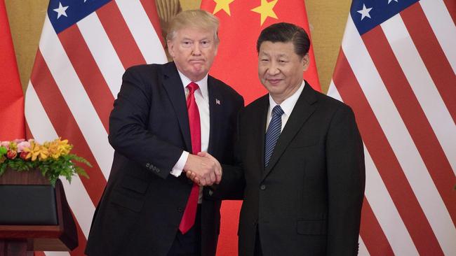 US President Donald Trump shakes hands with China's President Xi Jinping during a press conference at the Great Hall of the People in Beijing in 2017.