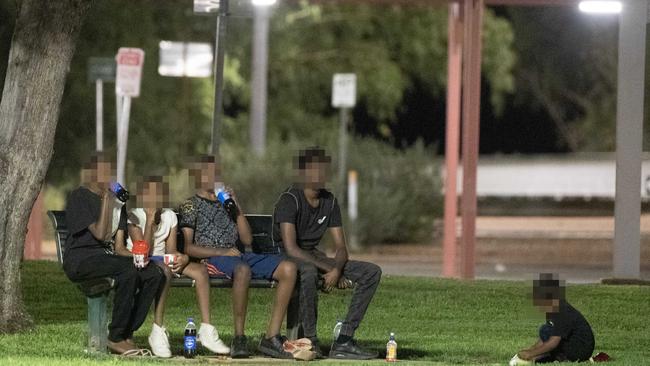 Young Indigenous Australians on the street late at night in Alice Springs.