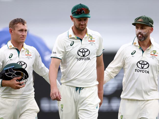 Josh Hazlewood (C) has yet to fully recover from the injury with derailed his summer. Picture: AFP