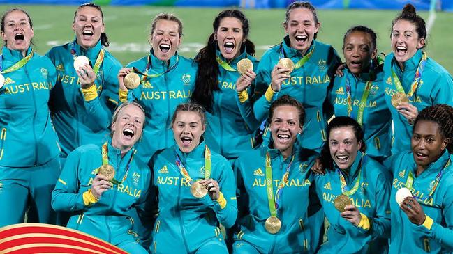 Australia’s women’s Rugby Sevens team celebrate after winning the gold medal match against New Zealand at the 2016 Rio Olympics.