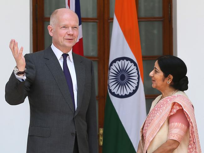 British Foreign Secretary William Hague speaks with Indian Foreign Minister Sushma Swaraj this month. AP Photo /Manish Swarup