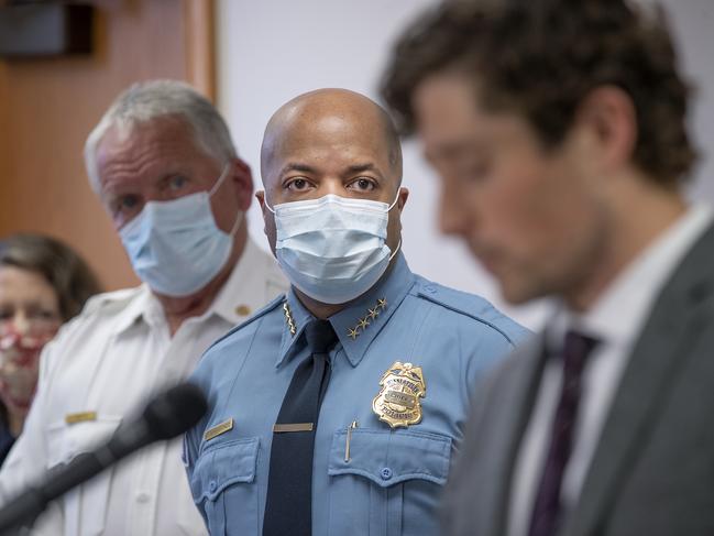 Minneapolis Police Chief Medaria Arradondo, left, listens as Minneapolis Mayor Jacob Frey becomes emotional during a news conference. Picture: AP