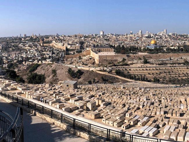 TOPSHOT - A picture taken with a smartphone using panoramic mode on December 1, 2017 shows a view of Jerusalem from the Mount of Olives. US President Donald Trump may recognize Jerusalem as the capital of Israel.  The international community says Jerusalem's status must be negotiated between Israelis and Palestinians. Israel has occupied east Jerusalem since the 1967 Six-Day War and later annexed it in a move never recognised by the international community.  The Palestinian president's office warned today of the potential destructive effects of any move denying their claim to east Jerusalem as the capital of their future state. / AFP PHOTO / THOMAS COEX