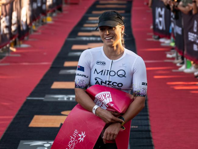 Hannah Berry crosses the finish line in the Cairns Airport IRONMAN Cairns. Picture Emily Barker.