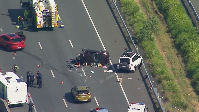 The horror crash scene on the Bruce Highway near Aussie World that claimed the life of a 22-year-old woman, before a man was shot in a car-jacking. Picture: Nine News