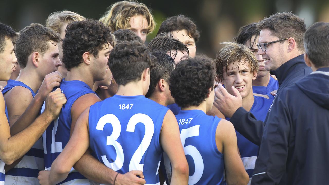 St Peter's versus Prince Alfred college footy Messenger Shield clash at St Peters. Coach addresses players at three quarter time. 11 May 2019. (AAP Image/Dean Martin)