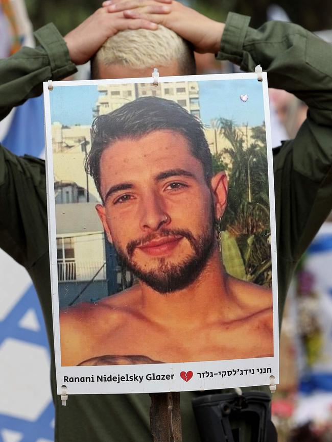 A visitor mourns at a memorial for people who were taken hostage or killed in the Hamas attack on the Supernova music festival on October 7. Picture: AFP