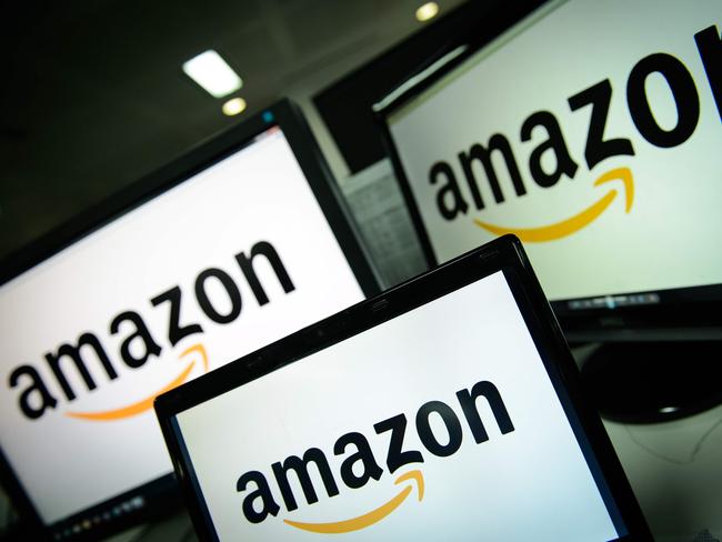 (FILES) In this file photo taken on December 11, 2014 the logo of the online retailer Amazon is displayed on computer screens in London. Traditional television titans are bulking up in a battle with online streaming giants Netflix and Amazon as viewers take to binging on shows when and where they want.The latest evidence was the surprise move this week by US cable giant Comcast to outbid Rupert Murdoch's 21st Century Fox for pan-European satellite TV group Sky with an all-cash offer valued at more than $31 billion (25 billion Euros).  / AFP PHOTO / LEON NEAL