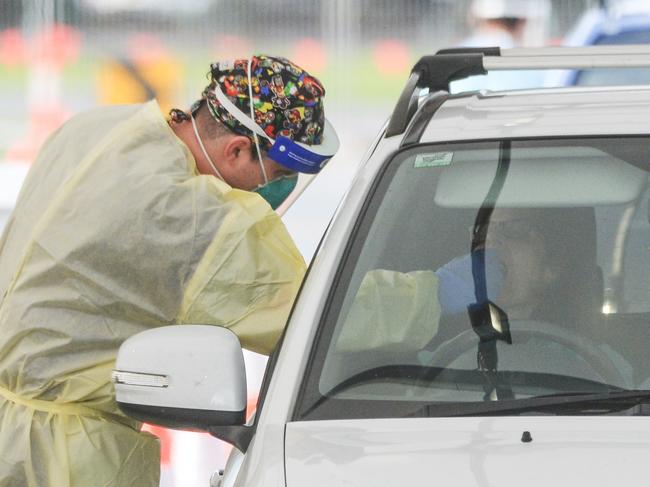 ADELAIDE, AUSTRALIA - NewsWire Photos JULY 01, 2021 -  Lines of cars and health workers at the Victoria Park Covid testing clinic in Adelaide. Picture: NCA NewsWire / Brenton Edwards