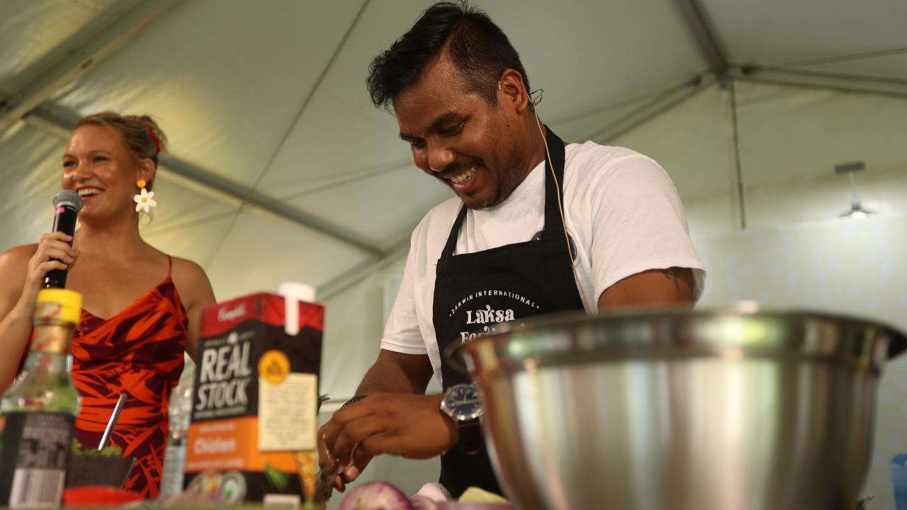 Amy Hetherington with Yogi's Way chef Bhairab Yogi as he hosted a cooking demonstration at the 2024 Darwin International Laksa Festival on Sunday, November 3. Picture: Zizi Averill