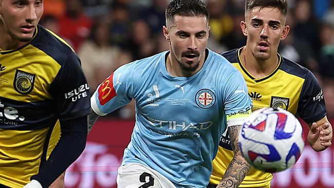 SYDNEY, AUSTRALIA - JUNE 03:  Jamie Maclaren of Melbourne City and Nectarios Triantis of the Mariners compete for the ball during the 2023 A-League Men's Grand Final match between Melbourne City and Central Coast Mariners at CommBank Stadium on June 03, 2023, in Sydney, Australia. (Photo by Cameron Spencer/Getty Images)