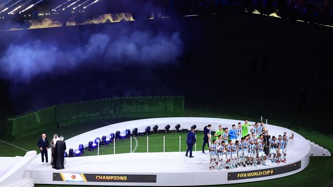 A stadium view of Argentina’s team receiving the trophy.