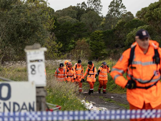 A forensics team searches the area on Brendan St in Greenvale after Adrian Romeo’s disappearance. Picture: Diego Fedele