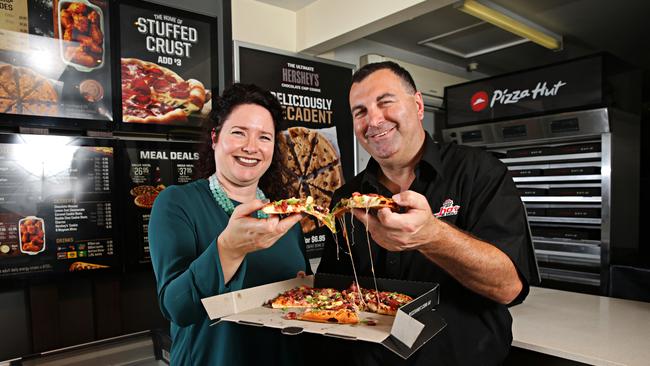 Pizza Hut chief executive Lisa Ransom and Collaroy store franchisee Michael Cooper at the first Eagle Boys store to be converted. Picture: Adam Yip