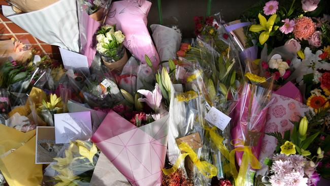 A growing amount of flowers and tributes are being left at the scene. Picture: Tricia Watkinson