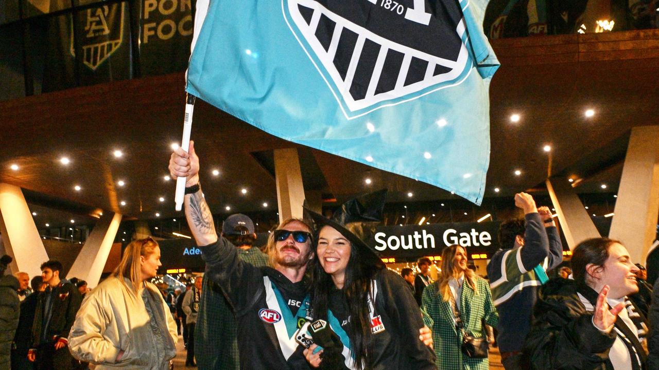 SEPTEMBER 13, 2024: Mitch Thomas and Emilee McNaughton celebrate Port defeating Hawthorn after the semi final at Adelaide Oval. Picture: Brenton Edwards