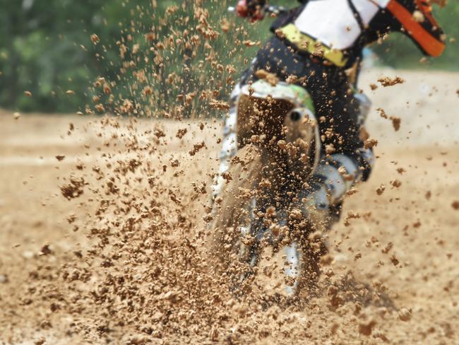 General, generic stock photo of mud debris flying from a rear tyre of a trail bike during a motocross dirt bike race. Photo: iStock - Getty Images.